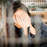 Woman,In,The,Cage,,Human,Trafficking,Concept,blurry,Portrait