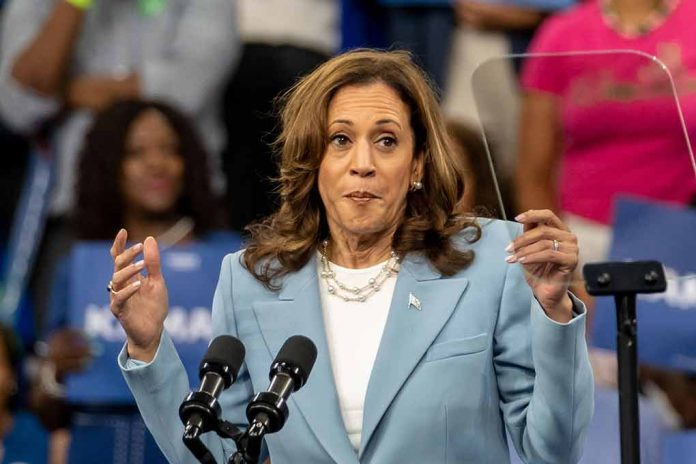 Woman speaking at a podium, gesturing with hands.