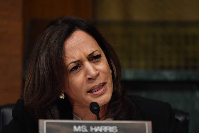 Woman speaking into a microphone while frowning.