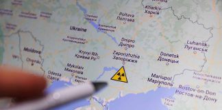 Map of Ukraine with a radiation warning symbol.