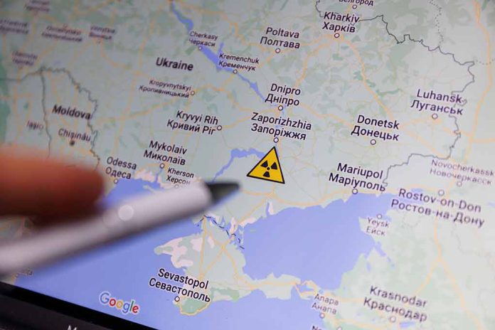 Map of Ukraine with a radiation warning symbol.