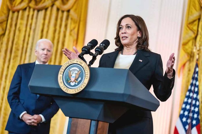 Two people speaking at a podium with microphones.