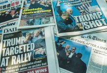 Newspaper headlines about Trump assassination attempt news.