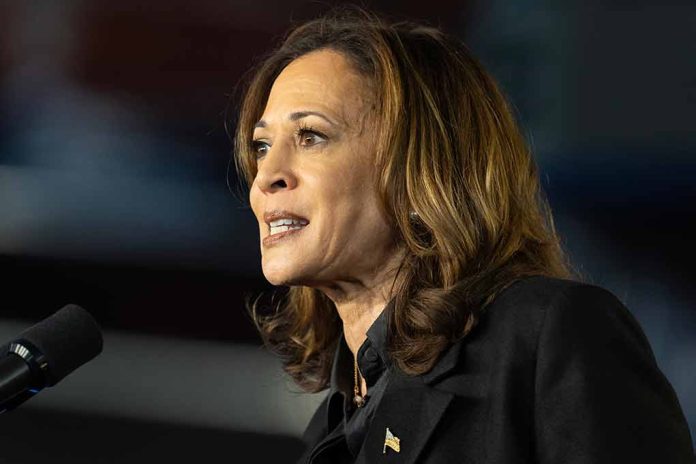 A woman speaking at a podium, wearing a blazer.