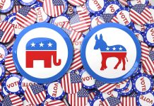 Republican elephant and Democratic donkey buttons, surrounded by flags.