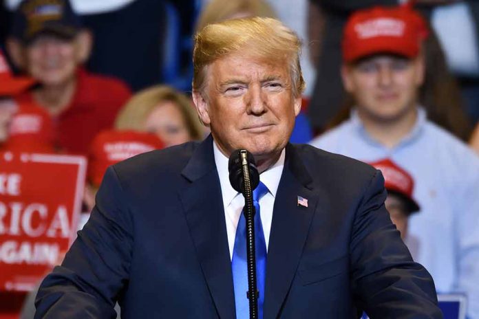 Man in suit speaking at a rally.