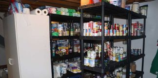 Shelves stocked with canned goods and household supplies.