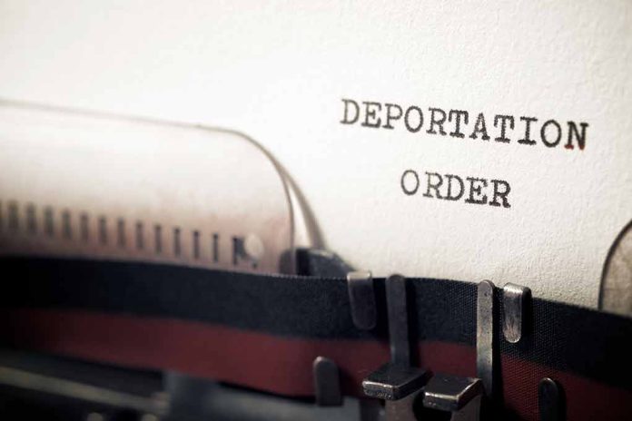 Typewriter with "Deportation Order" typed on paper.