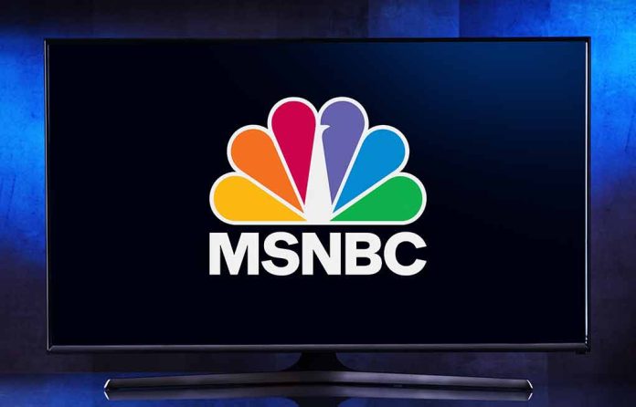 TV displaying MSNBC peacock logo on screen.