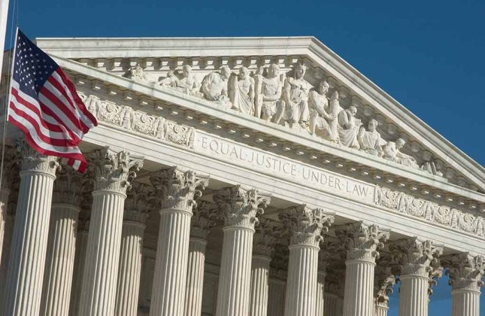 US Supreme Court building facade with flag.