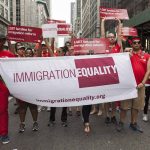 Group holding "IMMIGRATION EQUALITY" banner at a parade.