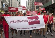 Group holding "IMMIGRATION EQUALITY" banner at a parade.