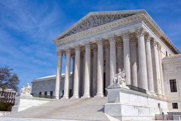 Supreme Court building with columns and statues.