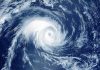 Satellite image of a swirling hurricane over ocean.