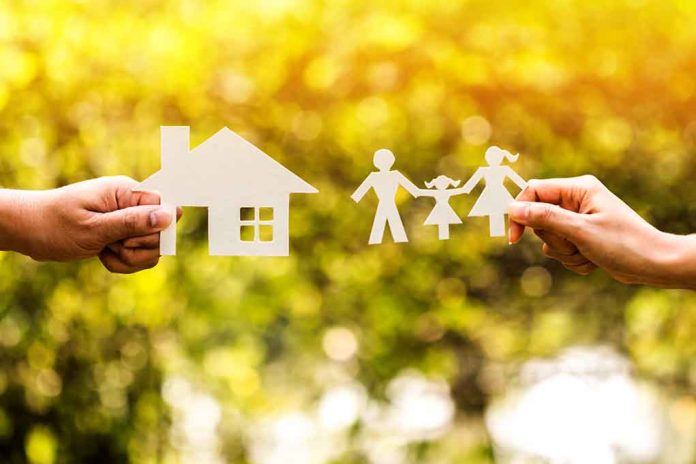 Paper cutouts of a house and family outdoors.