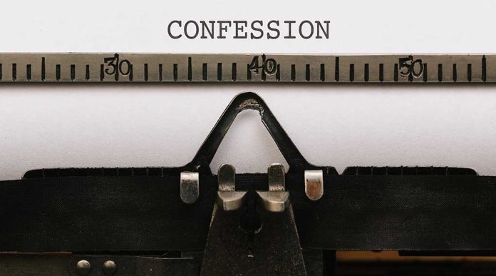 Typewriter with "CONFESSION" on paper.