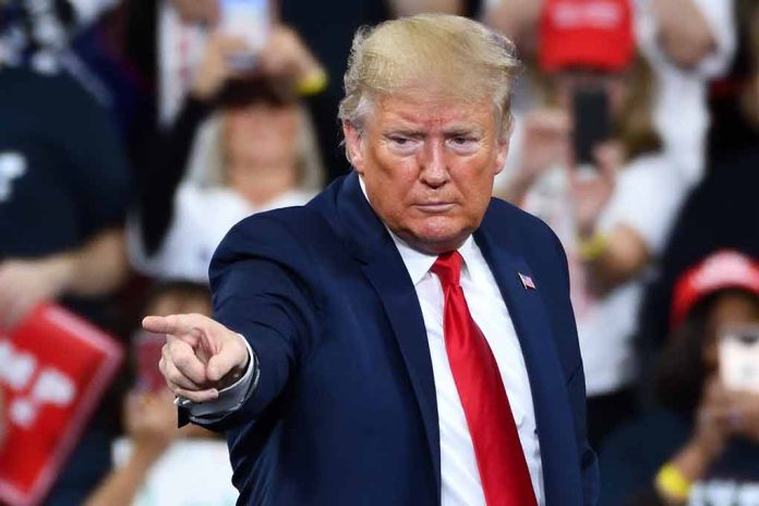 Man in suit pointing at audience during event