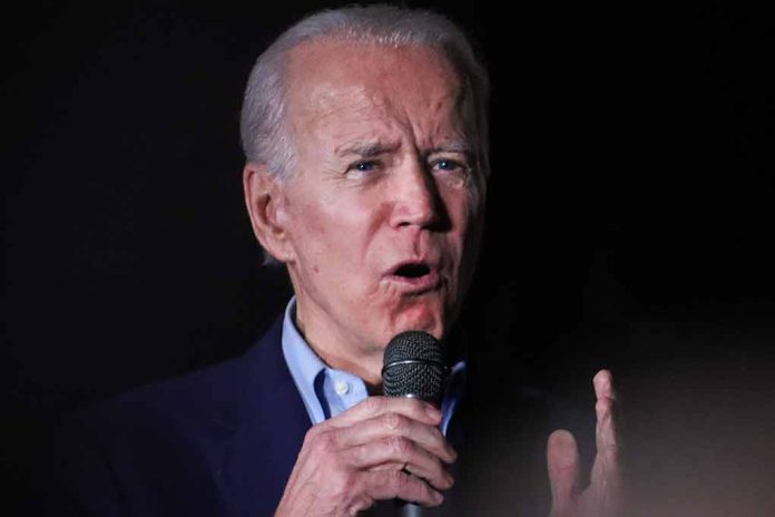 Man speaking into microphone in a dark setting