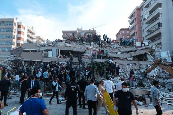 People at a collapsed building after an earthquake.