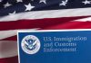 US flag with Immigration and Customs Enforcement sign