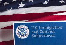 US flag with Immigration and Customs Enforcement sign