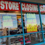 Store closing sale with going out of business signs.