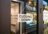 "Closing Down" sign on a shop door.