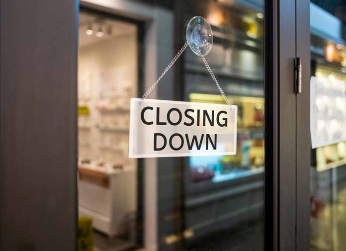 "Closing Down" sign on a shop door.