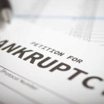 Petition for bankruptcy document with pen.