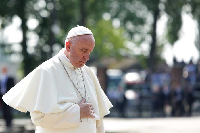 544259368 featured image Man in white religious attire looking down thoughtfully.