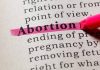 Abortion highlighted in a dictionary with a pink marker
