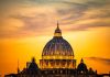 Dome of a cathedral at sunset with orange sky