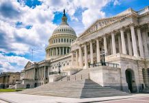 United States Capitol building with cloudy blue sky