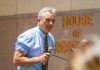 Man speaking outside House of Representatives building