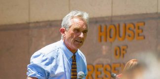 Man speaking outside House of Representatives building