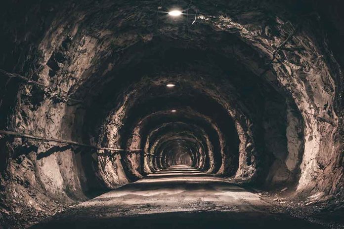 1698871978 featured image Dimly lit underground tunnel with rocky walls.