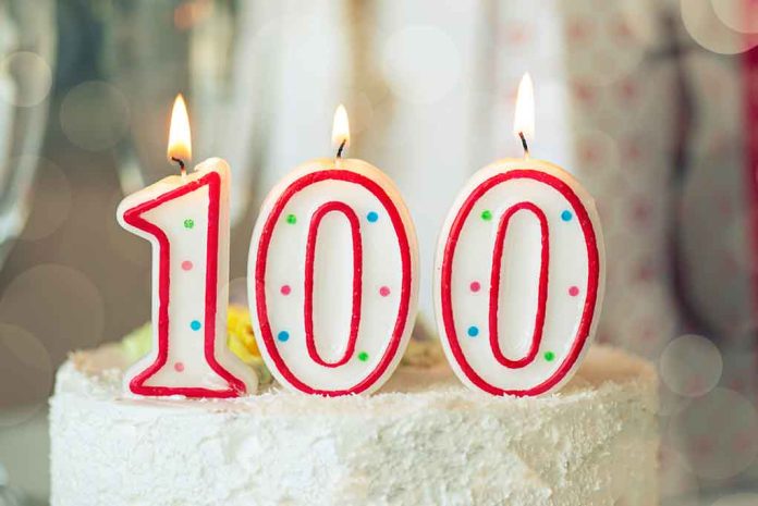 1933814060 featured image Candles shaped as 100 on a cake