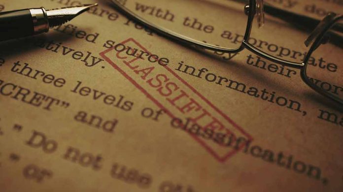 1947227164 featured image Classified document with glasses and pen closeup