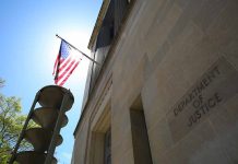 American flag at Department of Justice building exterior