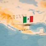 Mexican flag pin on map of Mexico