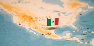 Mexican flag pin on map of Mexico