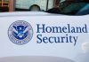 Homeland Security logo and text on vehicle door