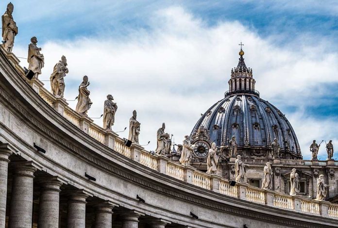 368201633 featured image St. Peter's Basilica dome with statues and clouds