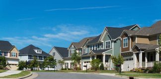 Suburban street with colorful modern houses