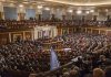 Large assembly meeting in a government chamber