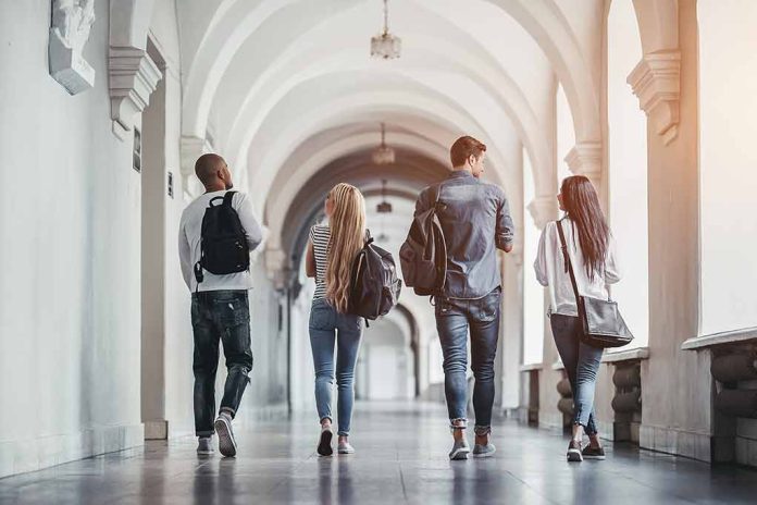 685407808 featured image Four students walking in a corridor together