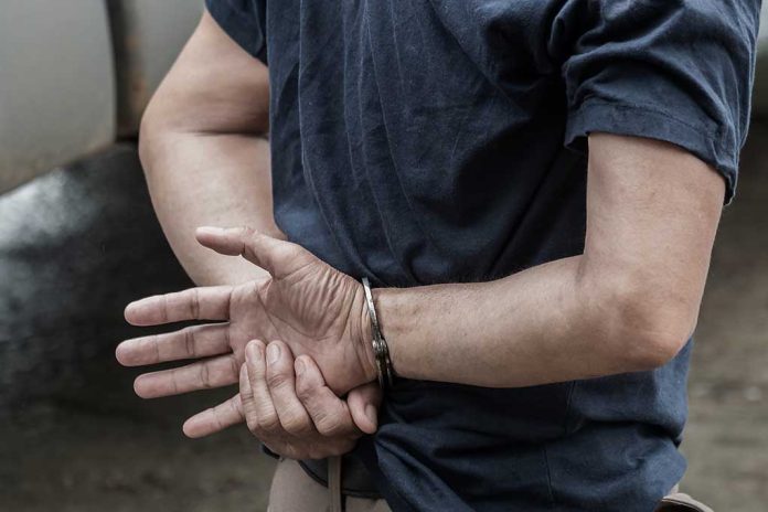 1115333126 featured image Person in handcuffs with hands behind back