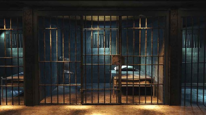 1427252378 featured image Empty prison cell with metal bars and bed