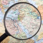 Magnifying glass over the Middle East and Egypt
