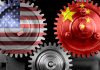 Interlocking gears with USA and China flags